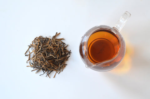 Golden Black Needle tea piled and steeped